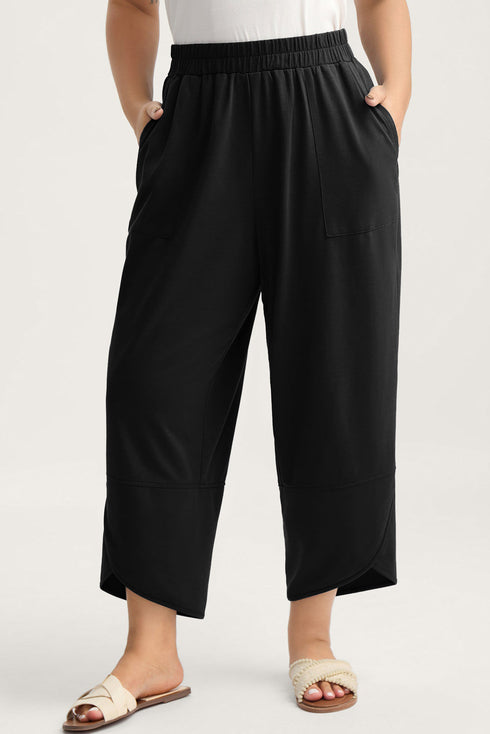 Solid Elastic Waist Asymmetrical Hem Loose Capri Pants