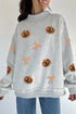 Sequin Pumpkin Face Bow Exposed Seam Pullover Sweatshirt