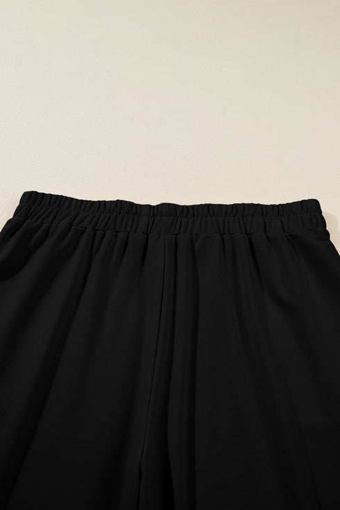 Solid Elastic Waist Asymmetrical Hem Loose Capri Pants