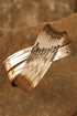 Elegant Textured Metal Crossover Cuff Bracelet