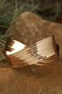 Elegant Textured Metal Crossover Cuff Bracelet