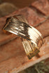 Elegant Textured Metal Crossover Cuff Bracelet