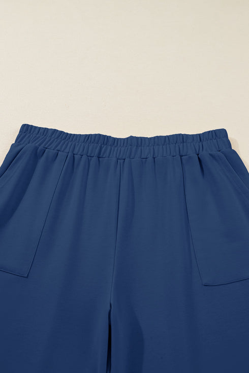 Solid Elastic Waist Asymmetrical Hem Loose Capri Pants