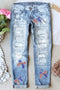 Flag Sequin Bow Graphic Distressed Light Wash Denim Jeans