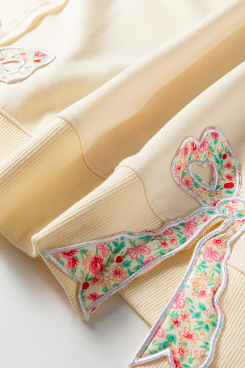 Floral Patched Raw Seam Bow Detail Baggy Long Sleeve Top
