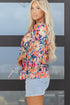 Floral Print Three Quarter Flare Sleeve Tie Neck Blouse