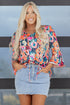 Floral Print Three Quarter Flare Sleeve Tie Neck Blouse