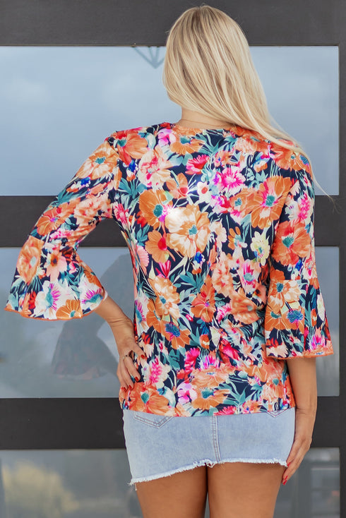Floral Print Three Quarter Flare Sleeve Tie Neck Blouse