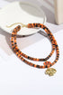 Layered Beaded Skull And Pumpkin Pendant Necklace