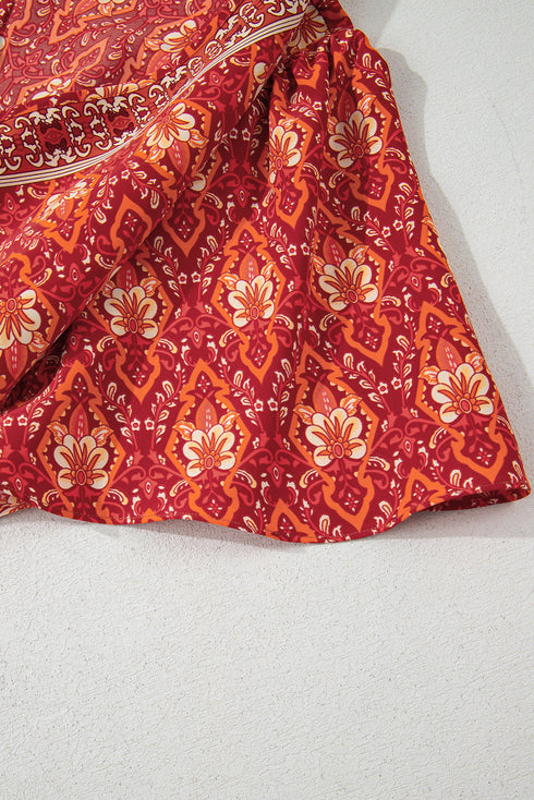 Orange Plus Size Printed Surplice Neck Empire Waist Flowy Mini Dress