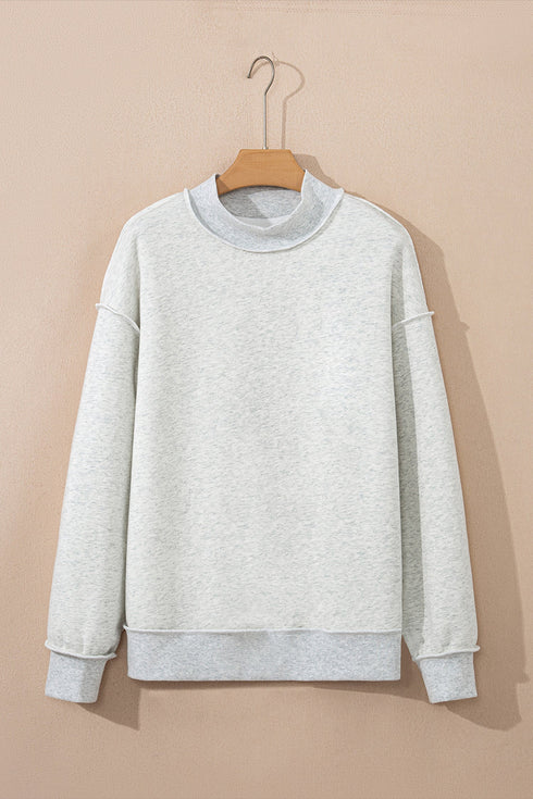 Relaxed Fit Exposed Seam Mock Neck Pullover Sweatshirt