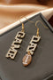 Rhinestone Embellished Football Motif Statement Dangle Earrings