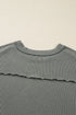 Ribbed Knit Twist Front Exposed Seam Long Sleeve Top
