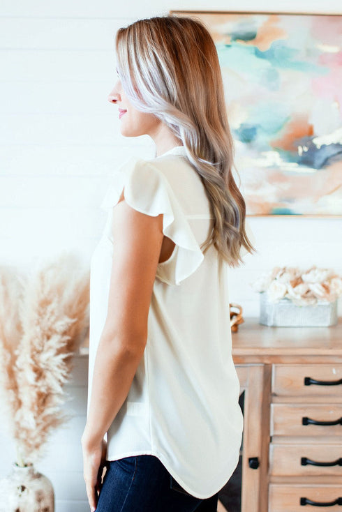 Ruffled Sleeveless V Neck Top