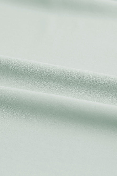 Ruffled Sleeveless V Neck Top