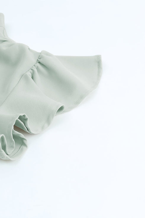 Ruffled Sleeveless V Neck Top