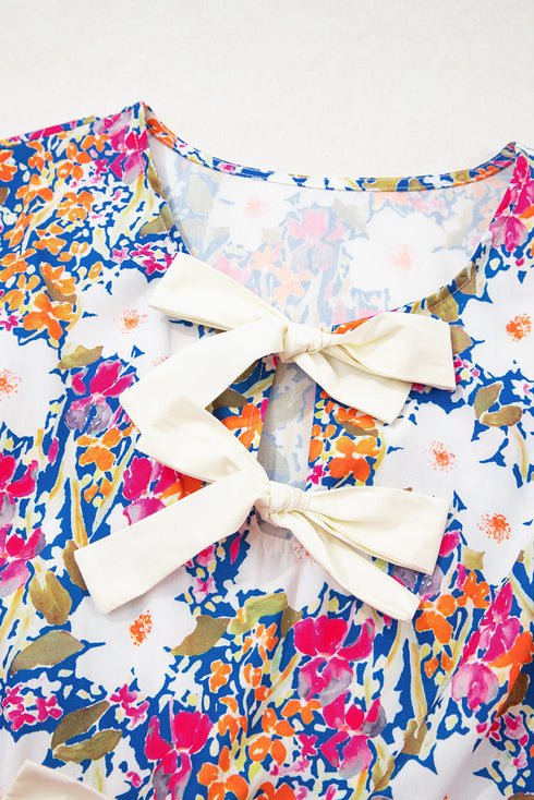 Sleeveless Floral Print Peplum Blouse With Bow Detail