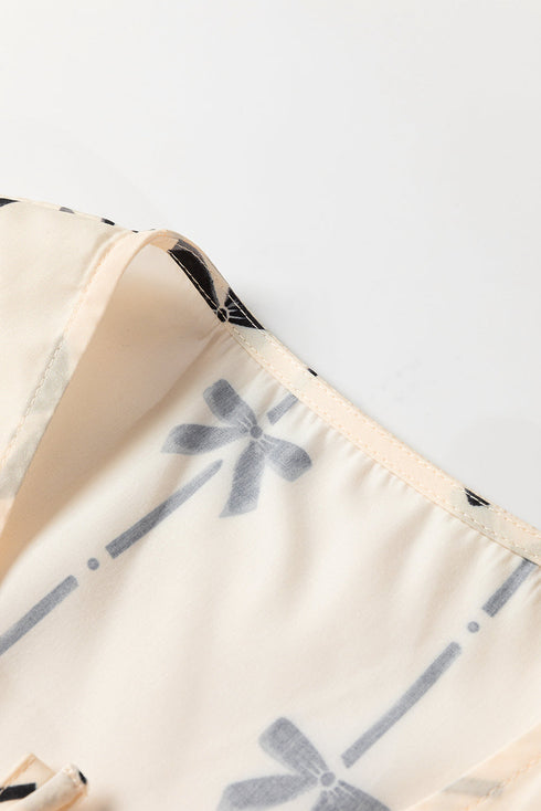 Sleeveless Tie Front Bow Print Peplum Top