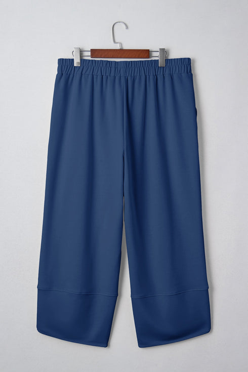 Solid Elastic Waist Asymmetrical Hem Loose Capri Pants