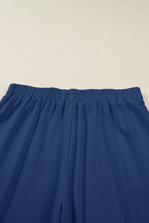 Solid Elastic Waist Asymmetrical Hem Loose Capri Pants