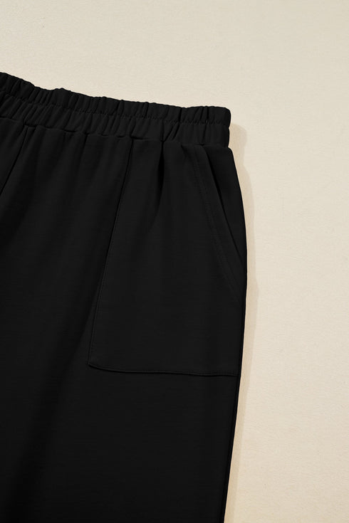 Solid Elastic Waist Asymmetrical Hem Loose Capri Pants