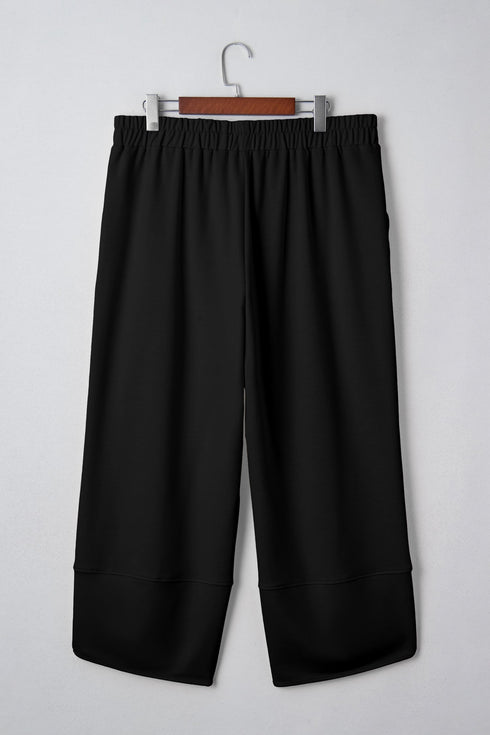 Solid Elastic Waist Asymmetrical Hem Loose Capri Pants