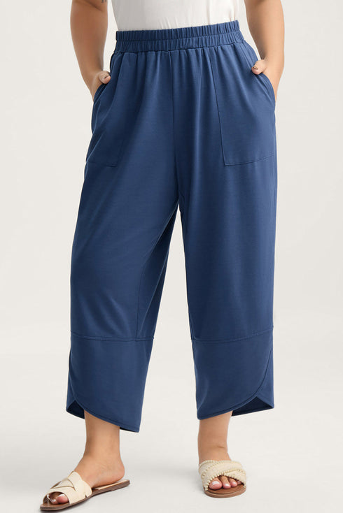 Solid Elastic Waist Asymmetrical Hem Loose Capri Pants