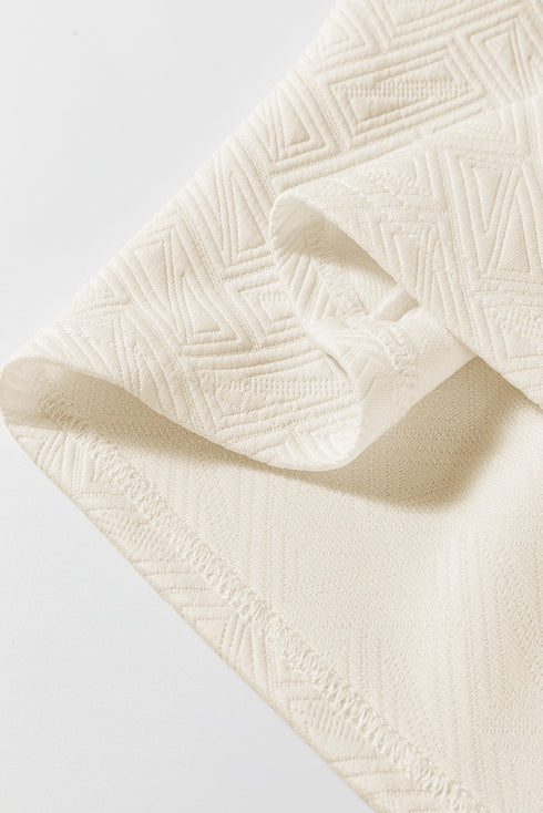 Textured Geometric Half Zip Short Sleeve Top