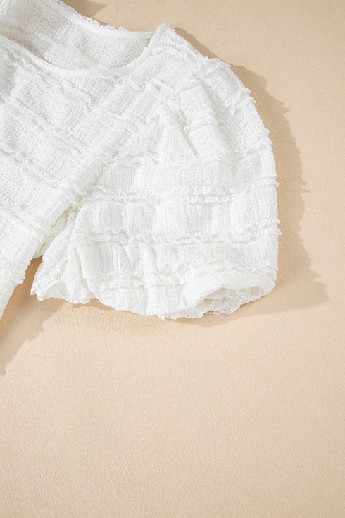 Textured Puff Sleeve Round Neck Blouse with Frayed Trim Accents